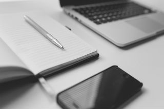Featured image: phone and computer.jpg - 5 Excellent Software Suggestions for Taking Your Business Mobile