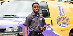 Featured image: Dryer Vent Wizard technician in front of van. - 3 Reasons Dryer Vent Wizard is a Great Investment for New Entrepreneurs