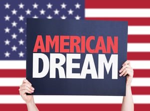 Featured image: Holding up an American Dream sign in front of an American flag - A franchise owner’s gratitude for the American Dream
