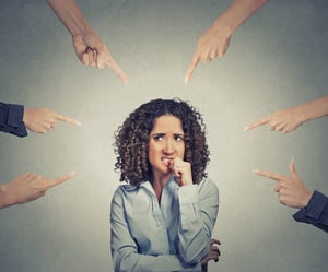 Featured image: Woman with hands pointing at her. - What To Do If You Hate Your Boss