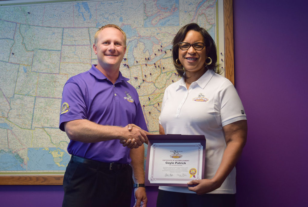 New Dryer Vent Wizard owner, Gayle Patrick, graduating from training with DVW President, Jason Kapica.