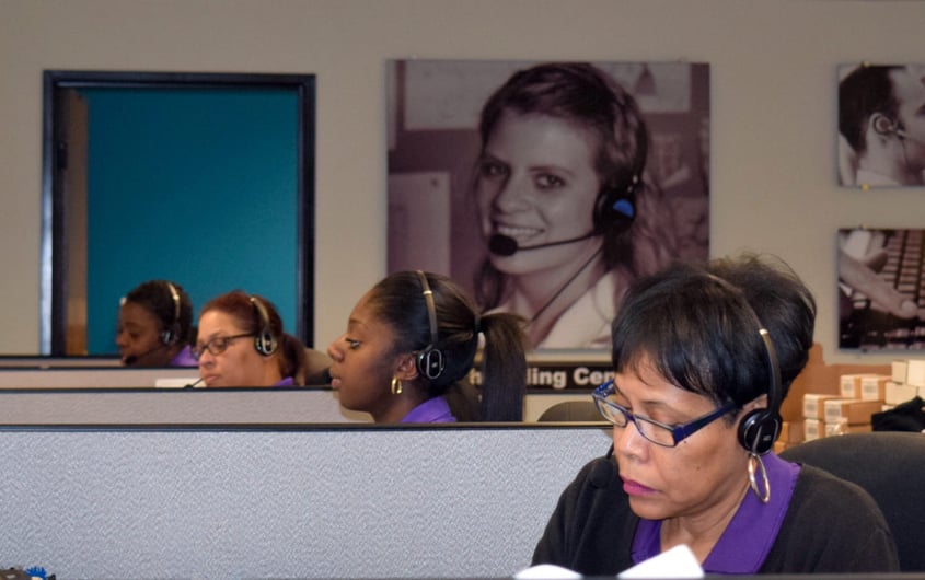 Women working in office cubicles