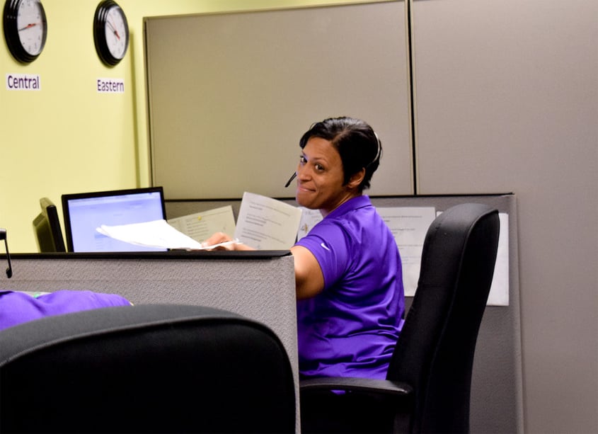 Woman working in an office cubicle