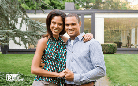 Married couple in front of a house. Married couple in front of a house.