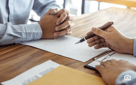 Close up of two mens' hands in business meeting.