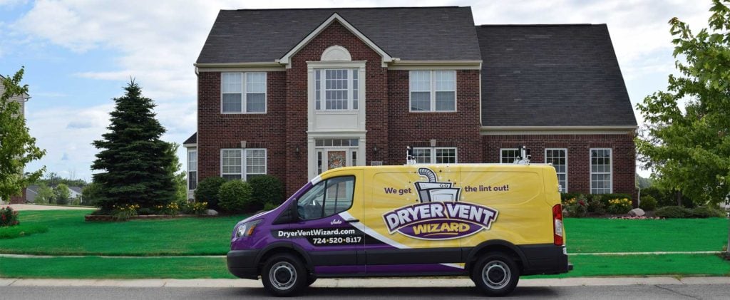 Dryer Vent Wizard van parked in front of a house
