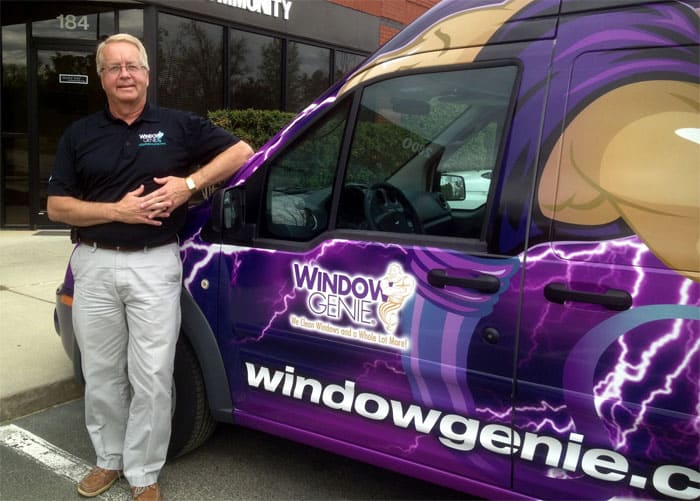Window Genie franchise owner Mike Boone of Raleigh, NC, with one of our franchises purple Geniemobiles.