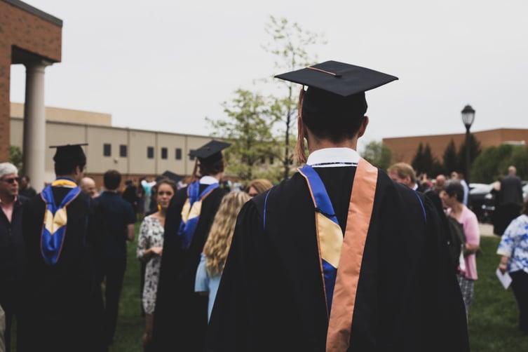 Featured image: photo-1525921429624-479b6a26d84d - Do you need a degree to run a franchised business?
